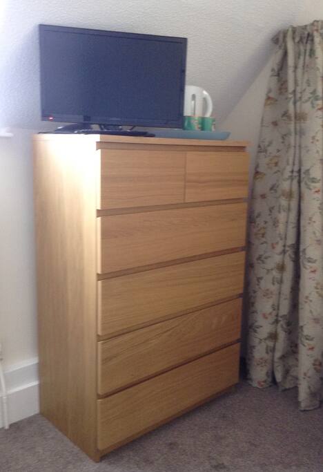 Your chest of drawer and wardrobe will keep all your clothes clean and tidy. Essential TV and coffee making facilities are to hand.Hair drier too ladies!