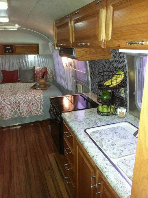Interior view of kitchen and sleeping area.
