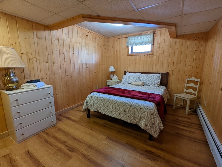 Lower bedroom with queen bed. 
