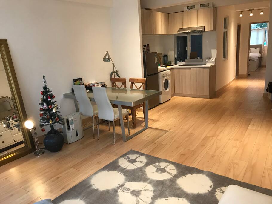 Open dining area with washing machine, dehumidifier, and fully equipped kitchen