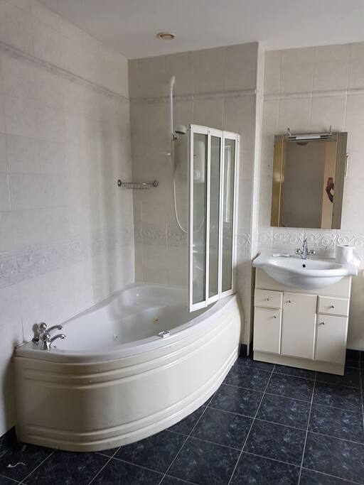 Very large shared bathroom with