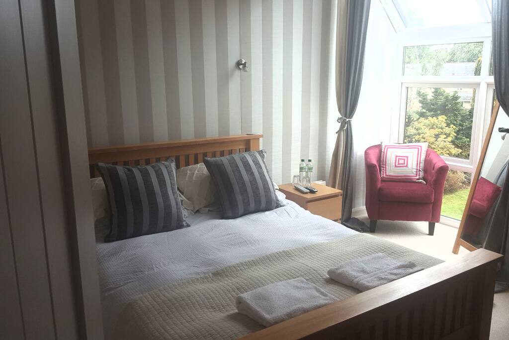 Main bedroom- king size bed, wi-fi, sky TV. Lovely views over the gardens