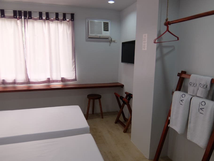Bedroom with DIY closet, towel holder, luggage holder, 42" cable television & air-conditioned unit