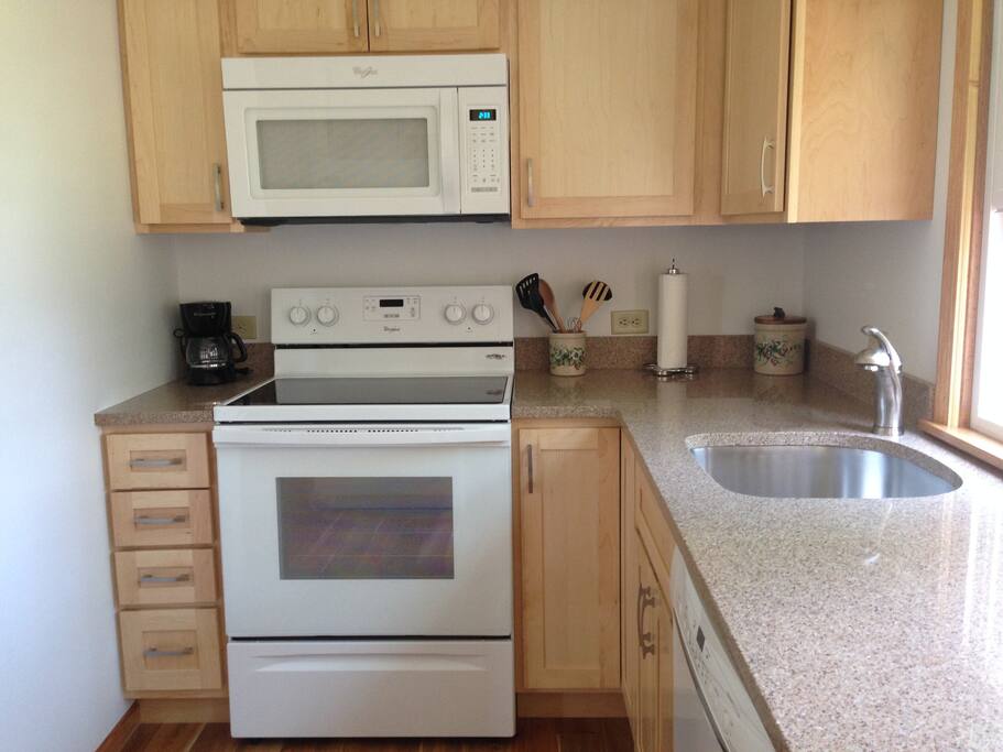 Granite countertops, large deep sink & new stove