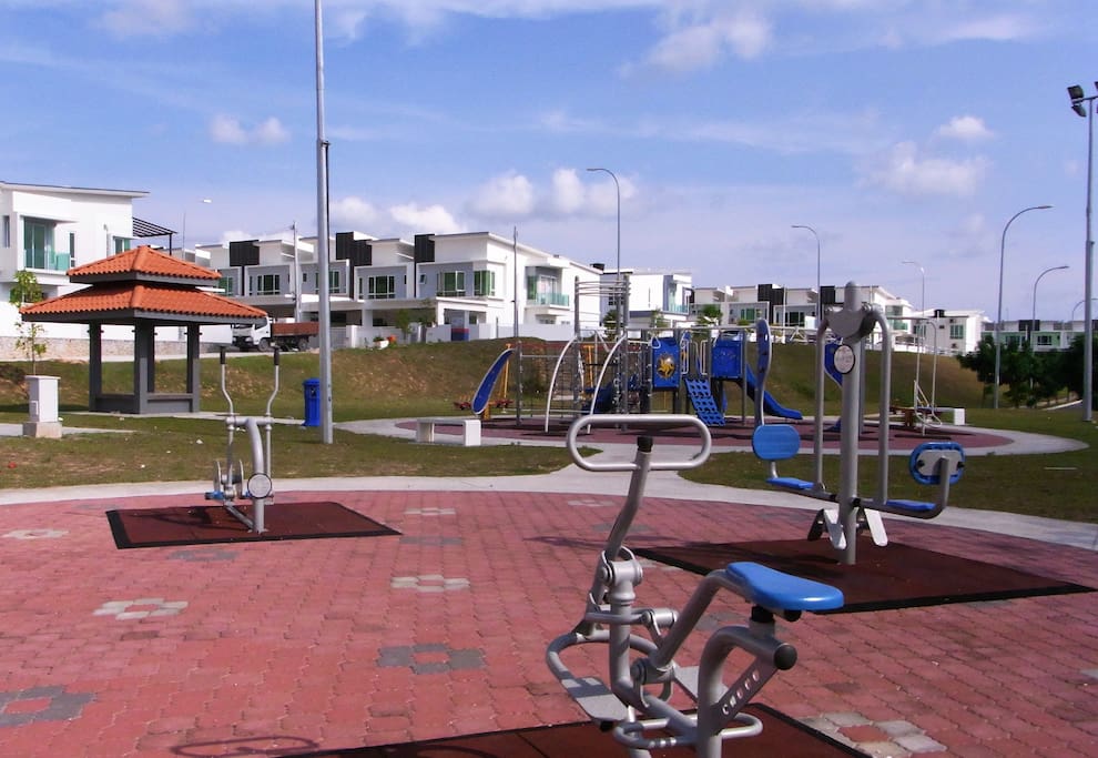 Public workout facilities and playground in front of the house