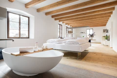 Open-space design apt in a historic farmhouse