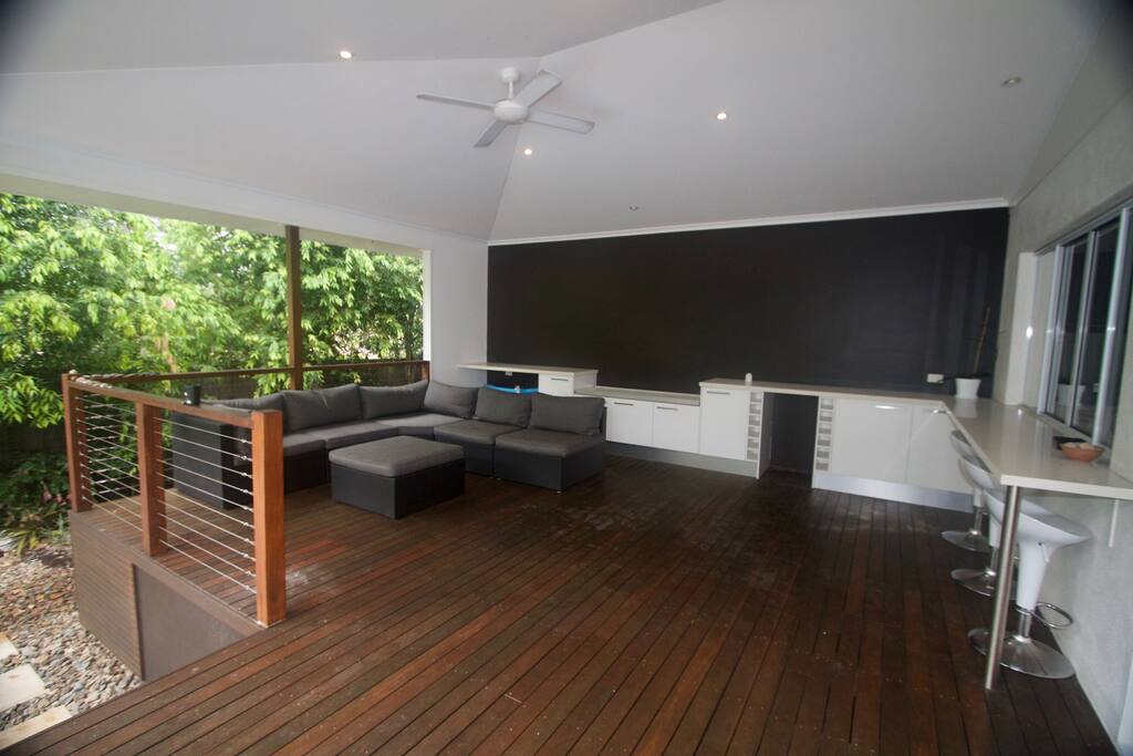 Relax on the outdoor lounge overlooking the pool area