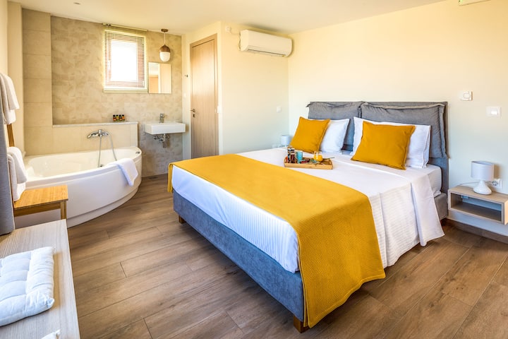 Second floor - Master Bedroom 2 with queen bed, ensuite bathroom with jacuzzi bath and panoramic sea views
