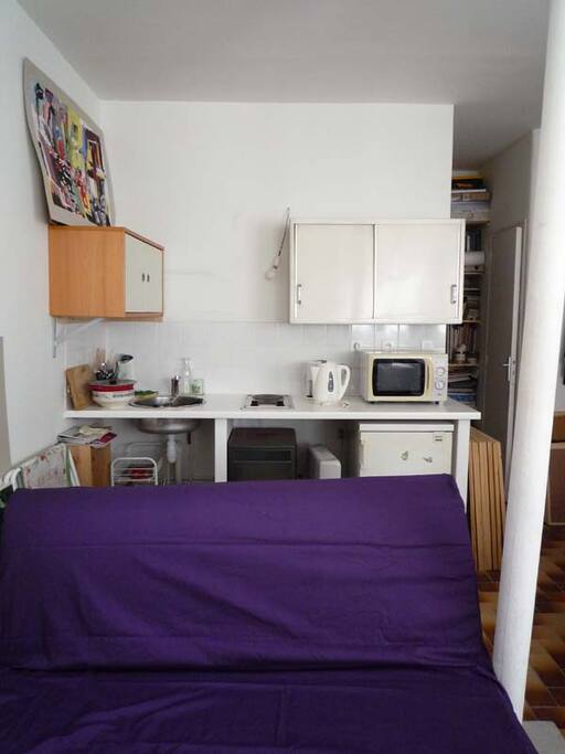 In our little kitchen, you can cook and warm your dishes. We have a little fridge also. Please note : the purple sofa bed does not exist any more that is shown on the photo.