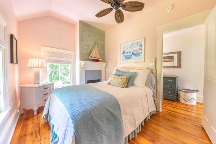 Full bedroom is tiny but so well designed with lofted ceilings, original details and beautiful views.