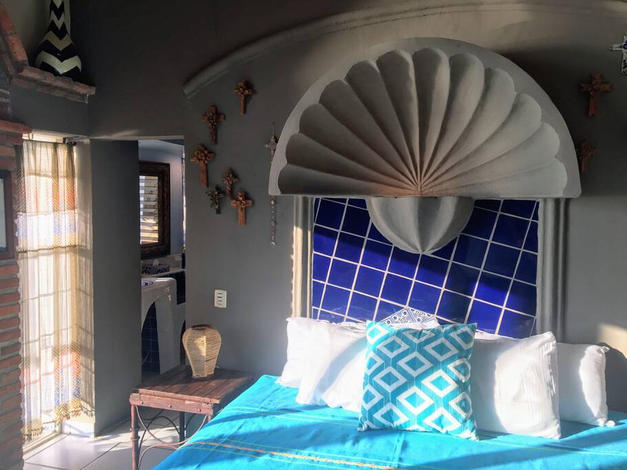 King bed and entrance to bathroom