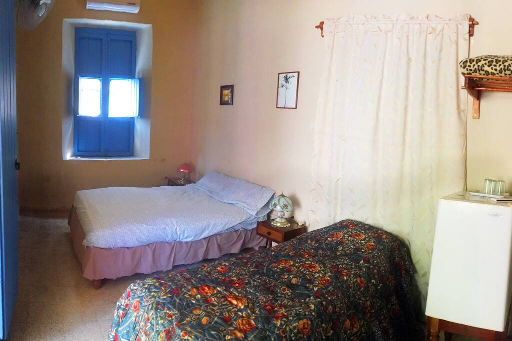 Your room with 1 full bed and 1 half, AC, fridge, full bath.
