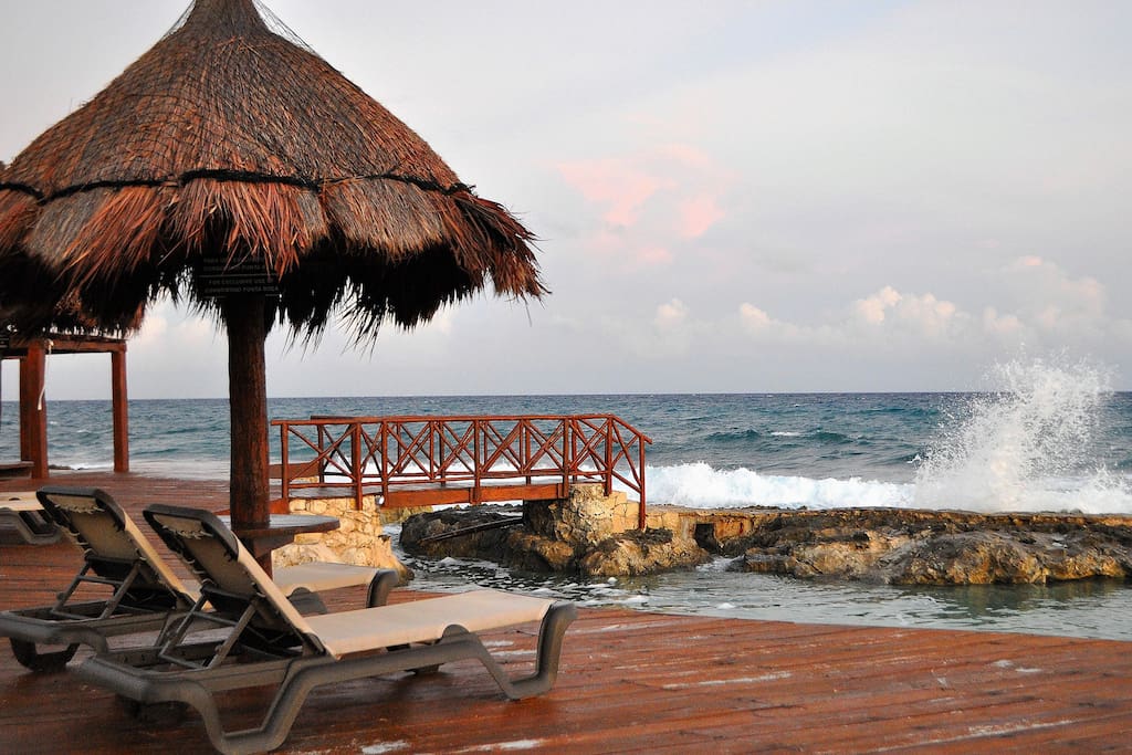 Enjoy the boardwalk and palapas down by the water.