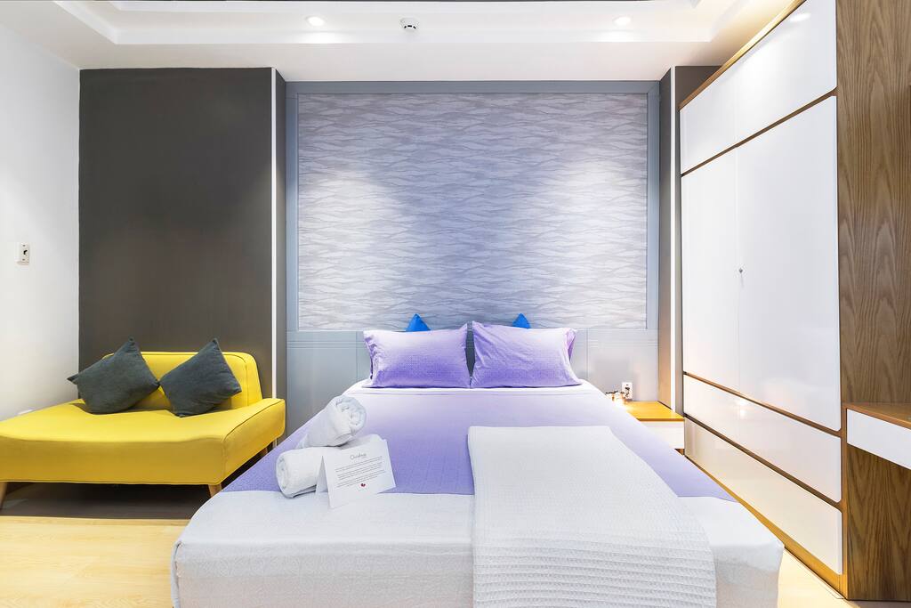 Queen-sized bed topped with soft Egyptian cottons linens