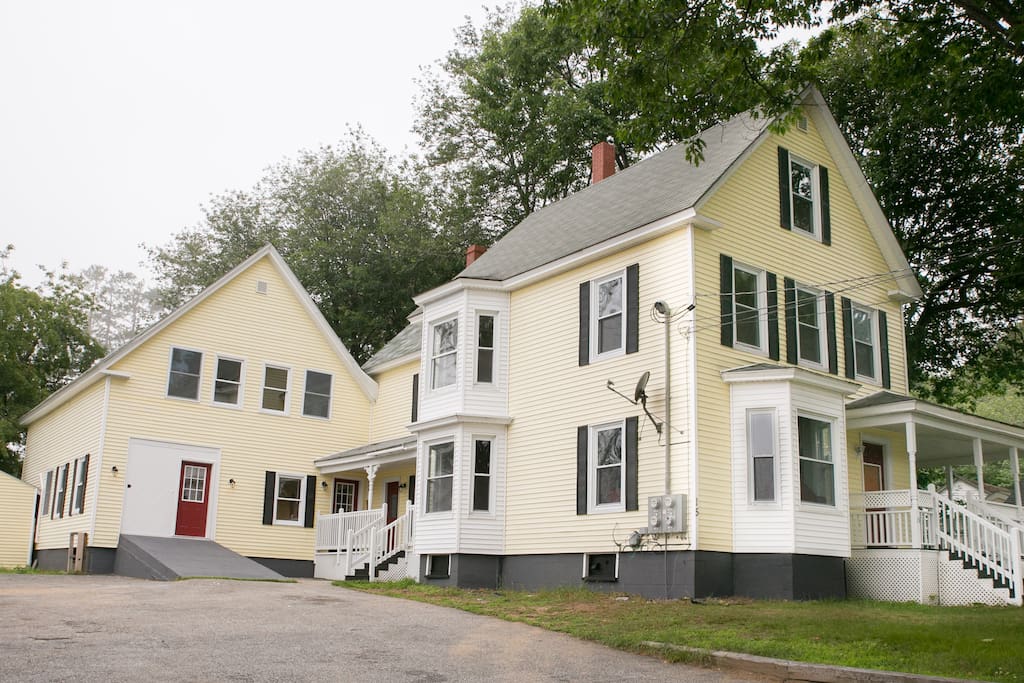 The apartment is above the red door on the 2nd floor