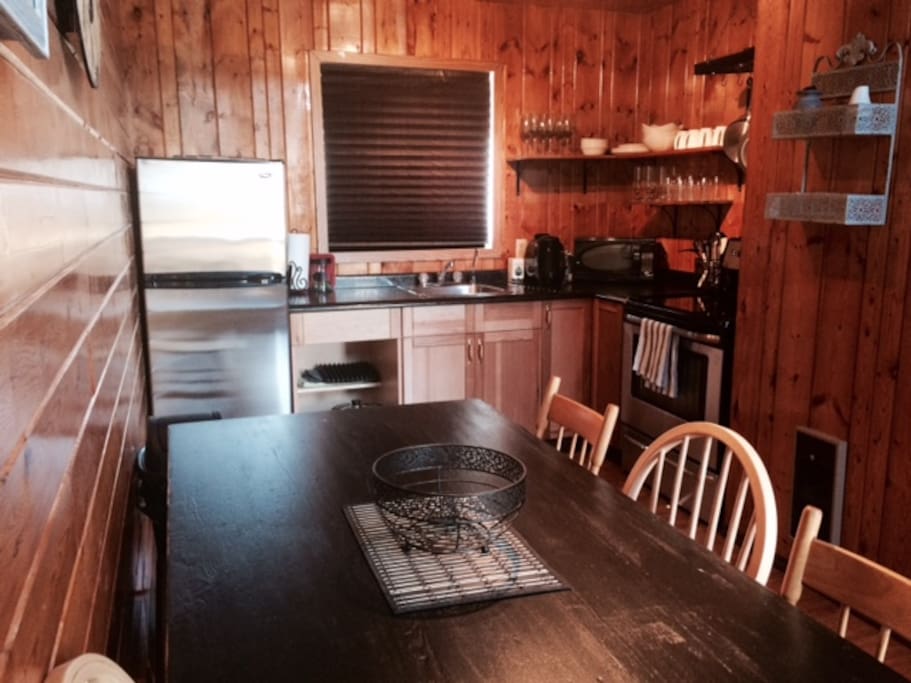 Fully equipped eat-in kitchen. Large table easily seats 6.