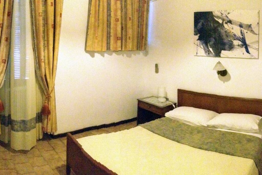bedroom with double bed and sea-view window