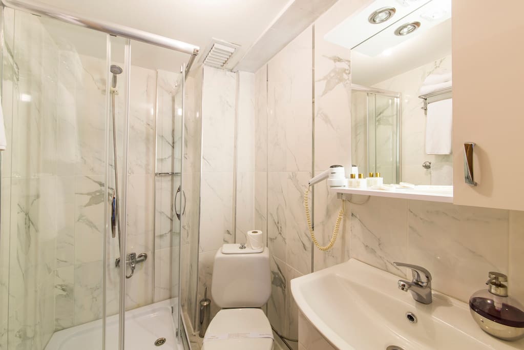 Spacious bathrooms with cabin shower. Complimentary soap, shampoo, slippers, towels, hair-dryer.