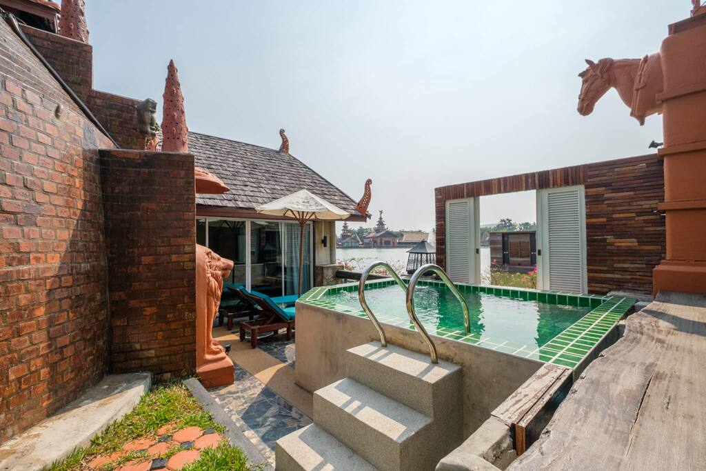outdoor garden with sun beds and private plunge pool
