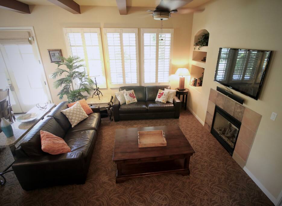 Living Room with 51" TV, Full Sleeper, & oversized coffee table for board games.