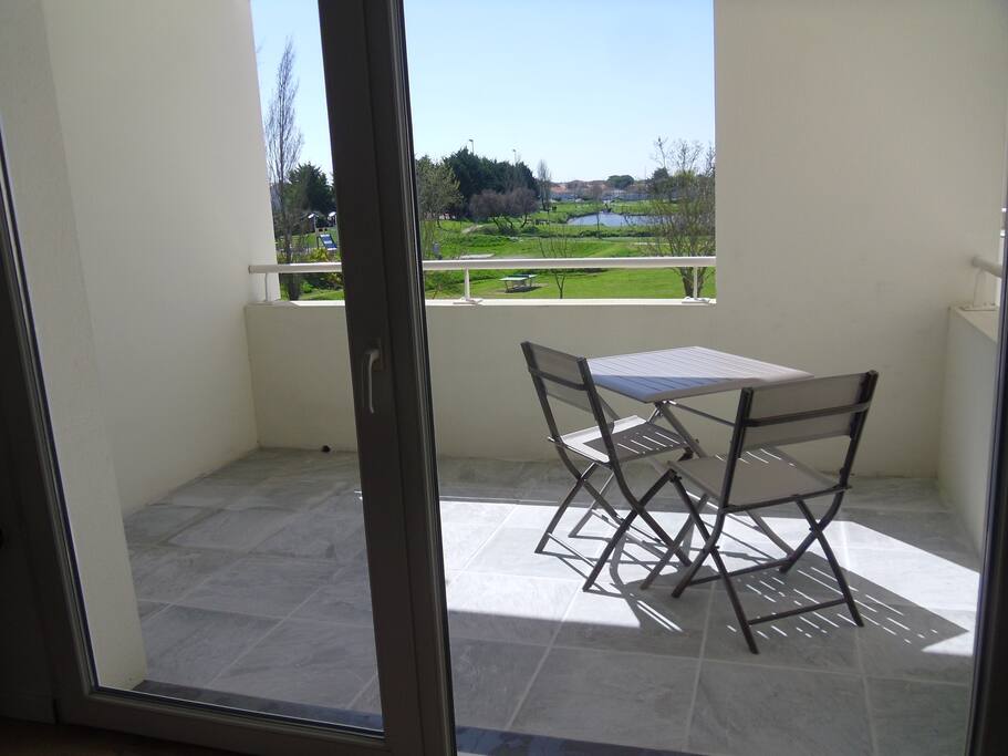 vue sur loggia parc et lac