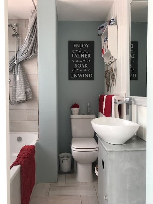 Private en-suite bathroom with bath and shower.