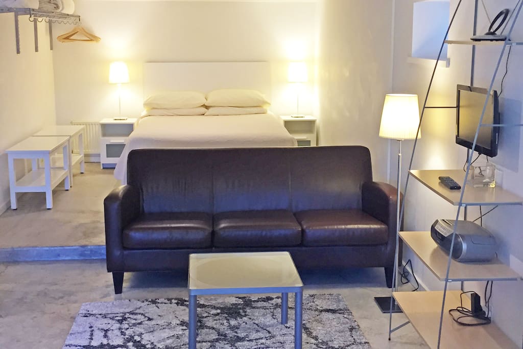 Sofa, coffee table, and TV.