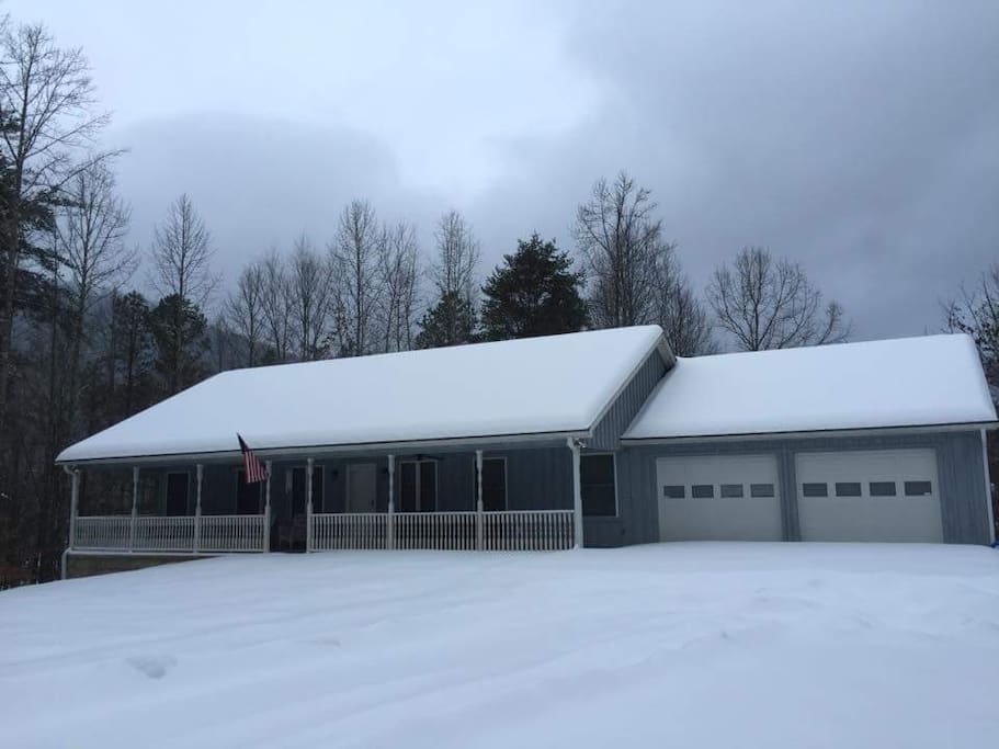 Front drive and wide, covered front porch with swing and furniture...snow not always included.