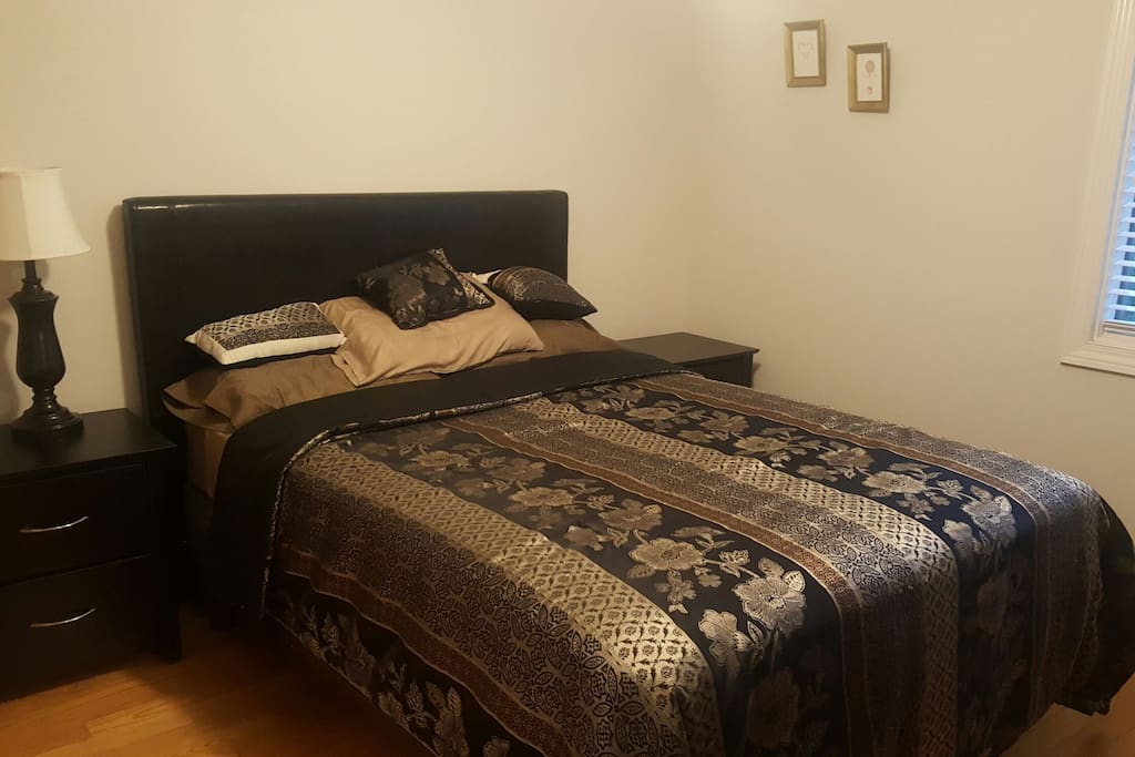 Comfortable queen bed with two side tables