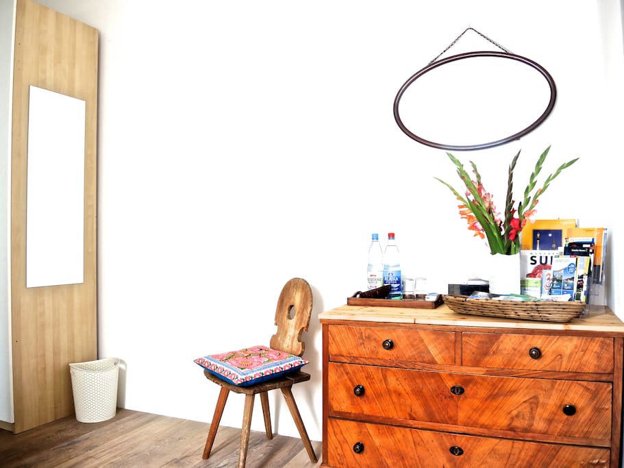 chest of drawers, brochures, mirror