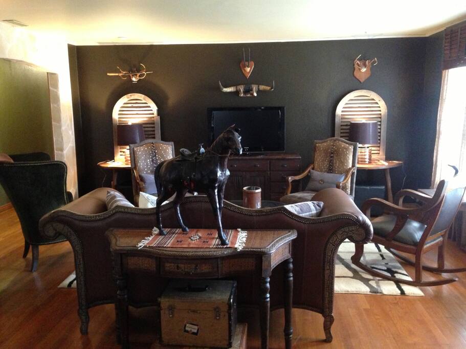 Sophisticated "John Wayne at Starbucks" decor featuring lots of hides, horns and hats, but with a good measure of contemporary art and pieces that make the Sayles Ranch more hip than the garden variety, ho hum western decor. 55 inch flatscreen TV
