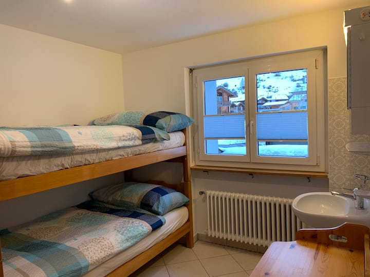 Bedroom with bunk bed and sink