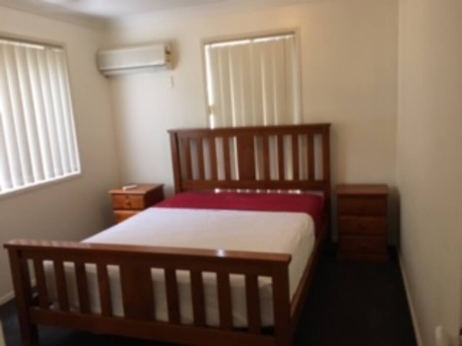 Bedroom 3 - Queen bed with air-conditioner, fan and built-ins.