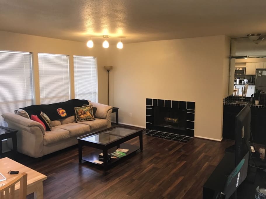 Plenty of space in the living area, with a fireplace and a flat screen TV