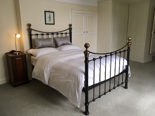 Spacious bedroom with en suite in period property
