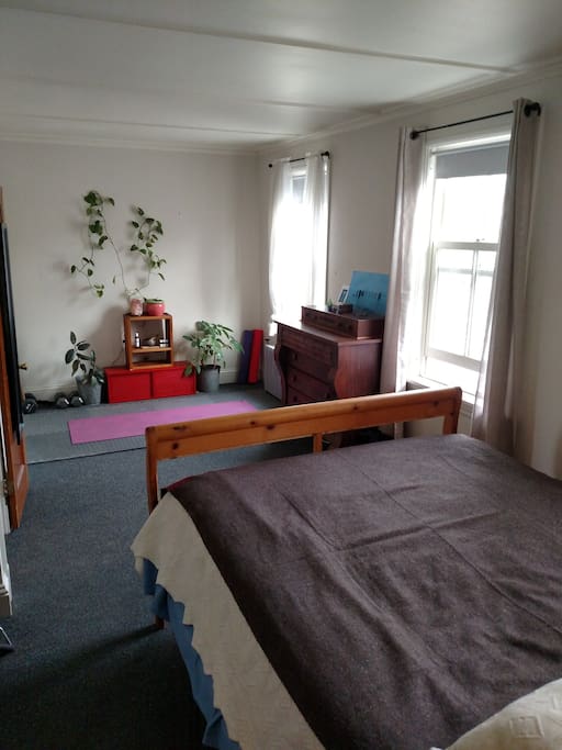 Bedroom has a cozy zen space to relax in.