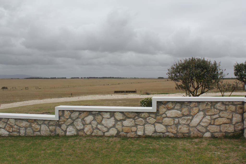 uninterrupted views stretch across the farmland to the mountains...