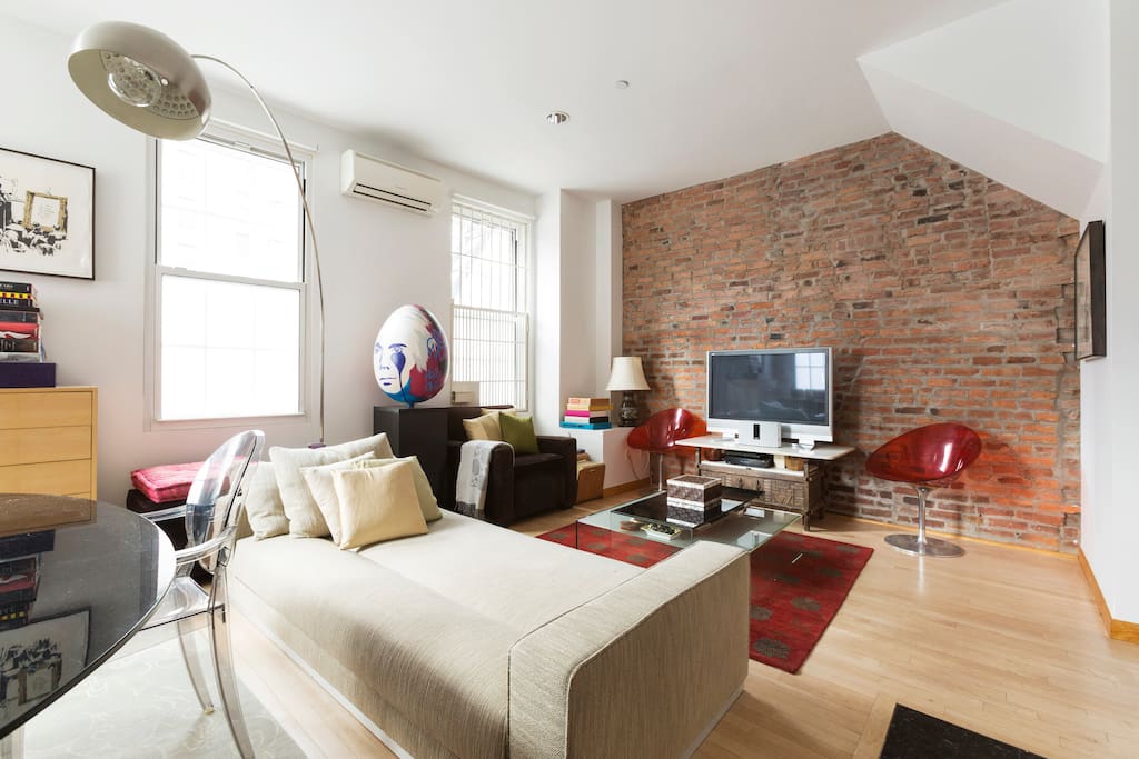 Large Living Area with exposed Brick - TV with FULL CABLE, & DVD - BOSE bluetooth sound dock