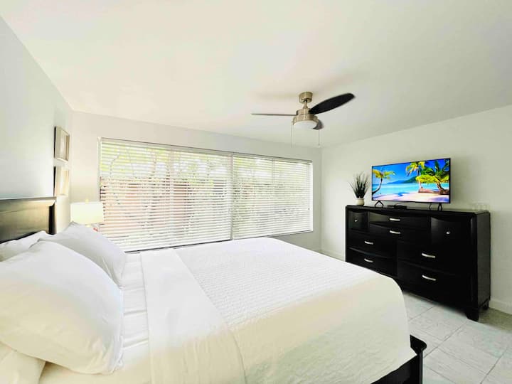 Large comfy bedroom with lots of natural light w/ Queen size bed.