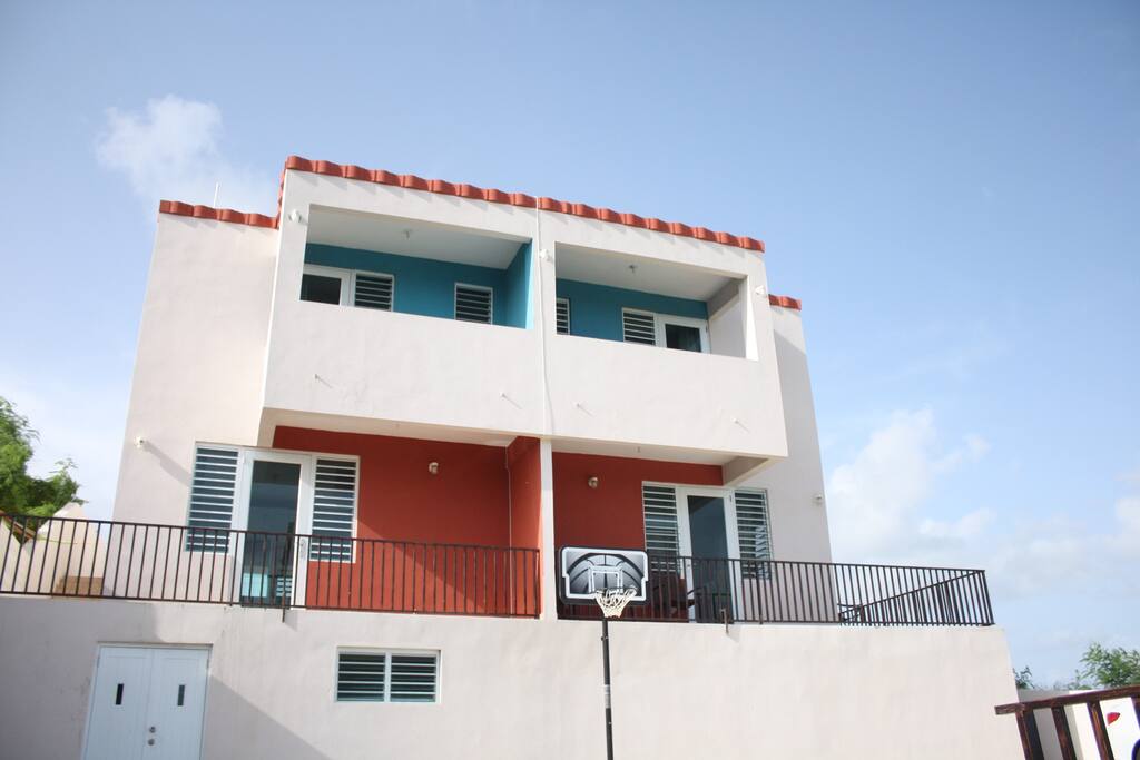 Villa Facade. 1st floor red. Notice the second balcony on left -acesss from master bed room.