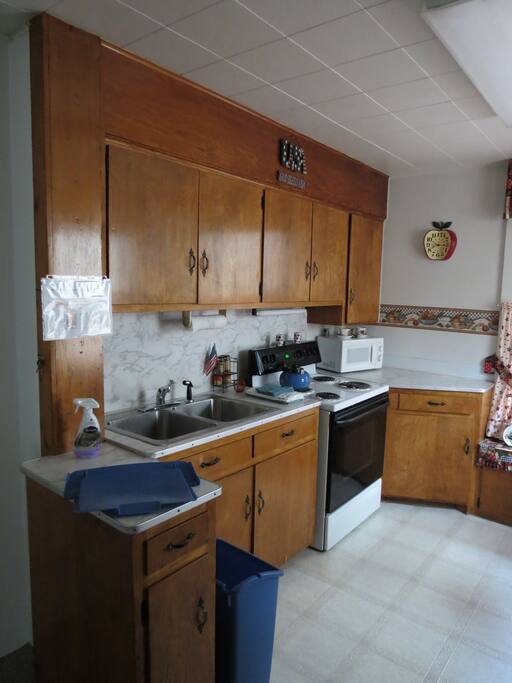 This Is the kitchenette that is attached to Americana room. It has ever thing you would need to cook and eat with. It has a refrigerator, stove, microwave, and coffee make.