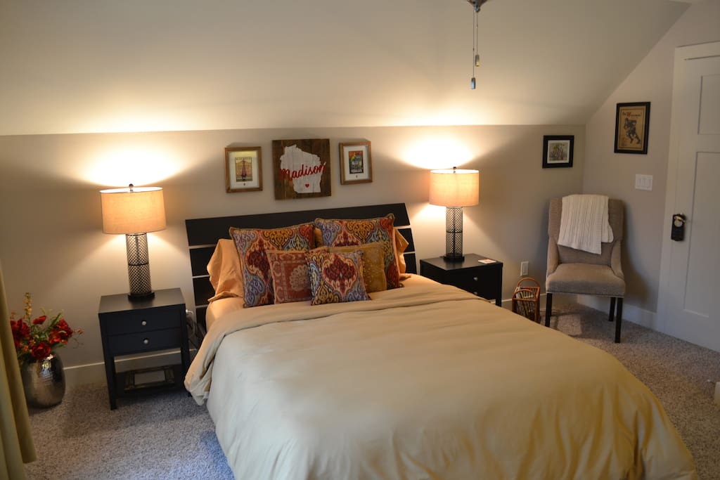 Private guest bedroom has a comfy queen bed with a feather duvet comforter, lots of light, and plenty of room for your belongings