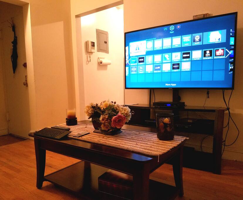 Living room has a large sofa, xbox 360, 55' Smart TV, Netflix, Hulu, Spotify, HBO GO, Youtube, cable with HBO