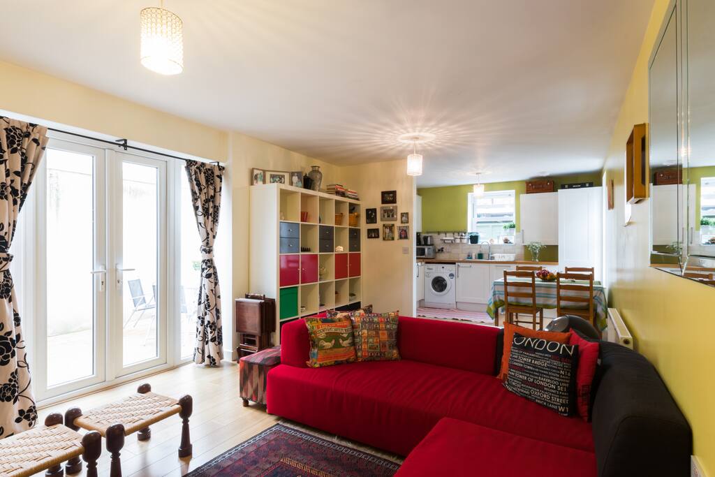 Living room with open-plan kitchen at the back