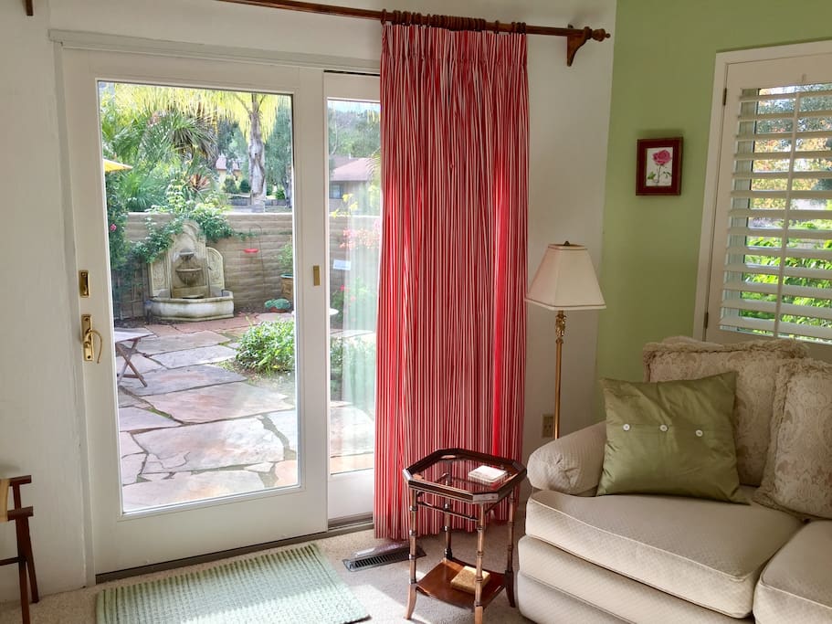 Bedroom with trickling fountain on private patio