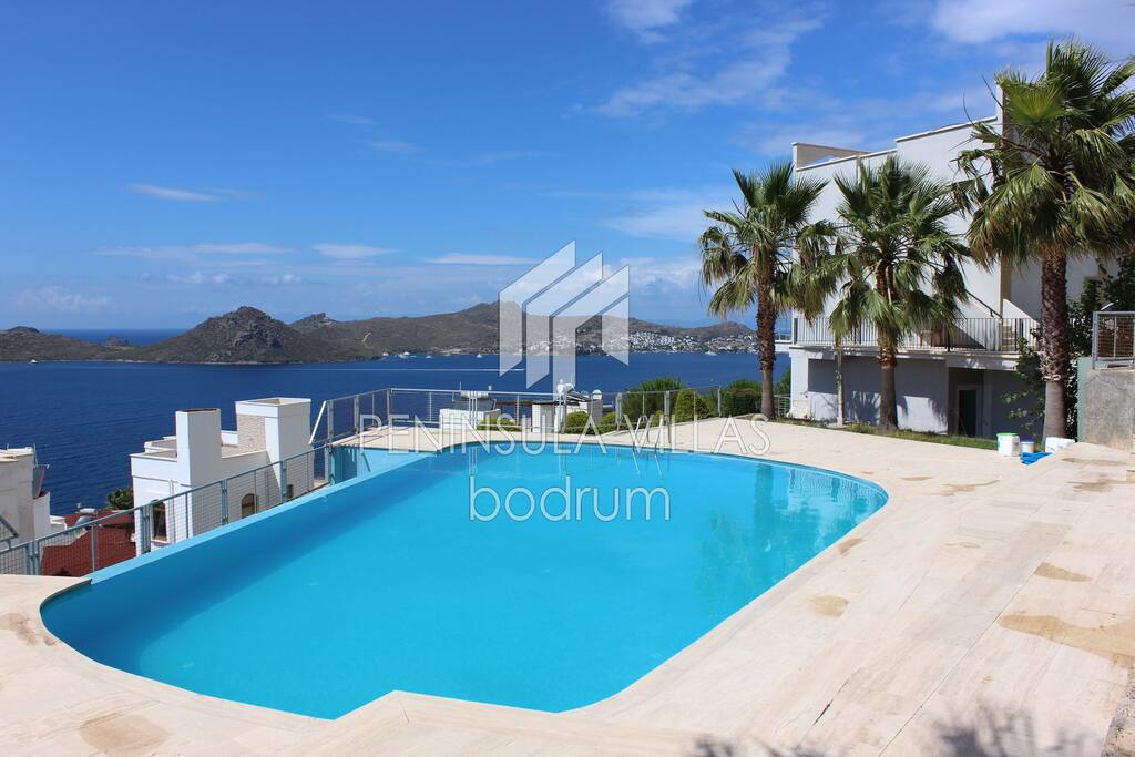 Swimming pool and views across Yalikavak bay