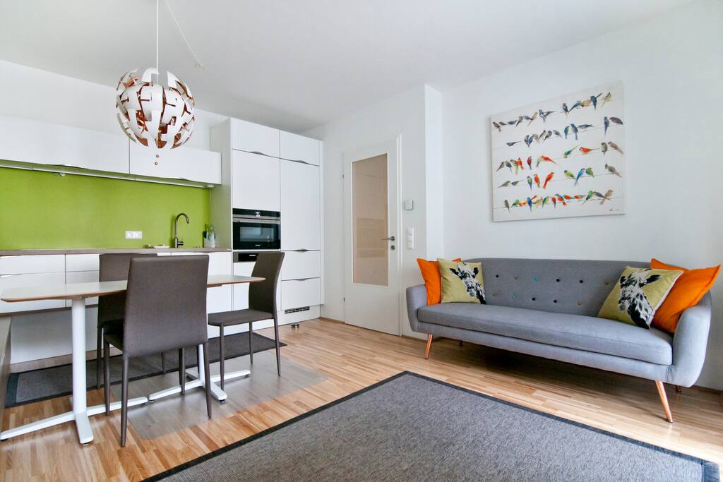 Cosy living room, dining table and superb equipped kitchen.