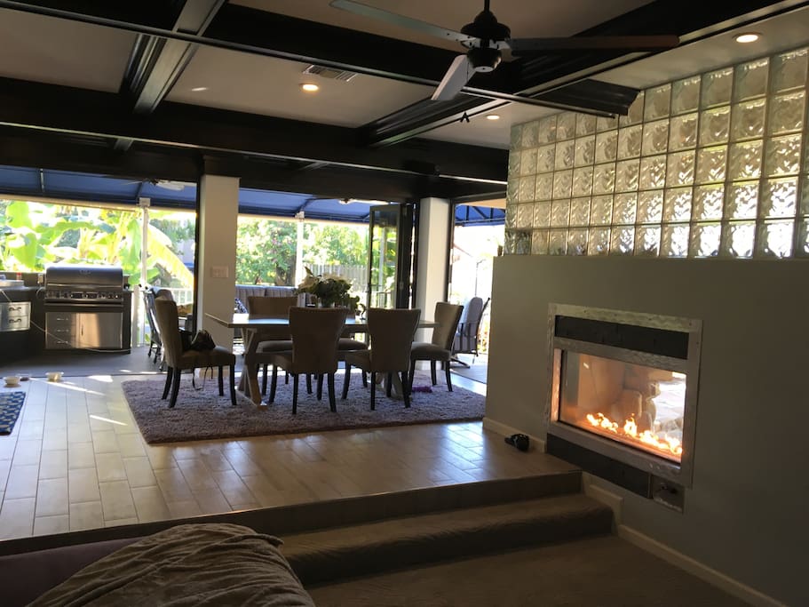Watch 70" TV from sumptuous couch where you can see the firewall right into the pool!