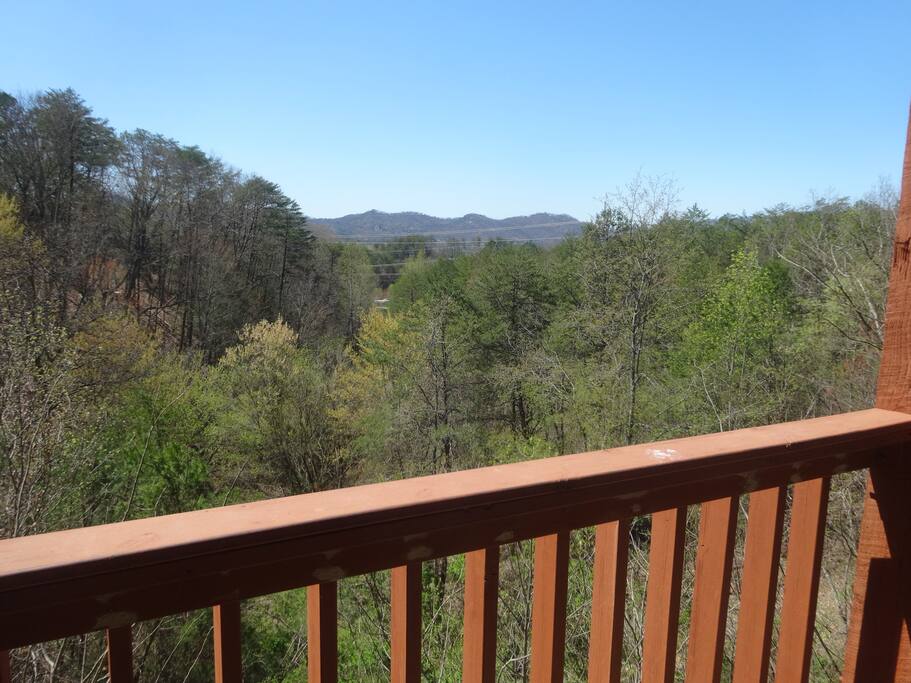 View from porch of valley below and mountains in the distance - spring view