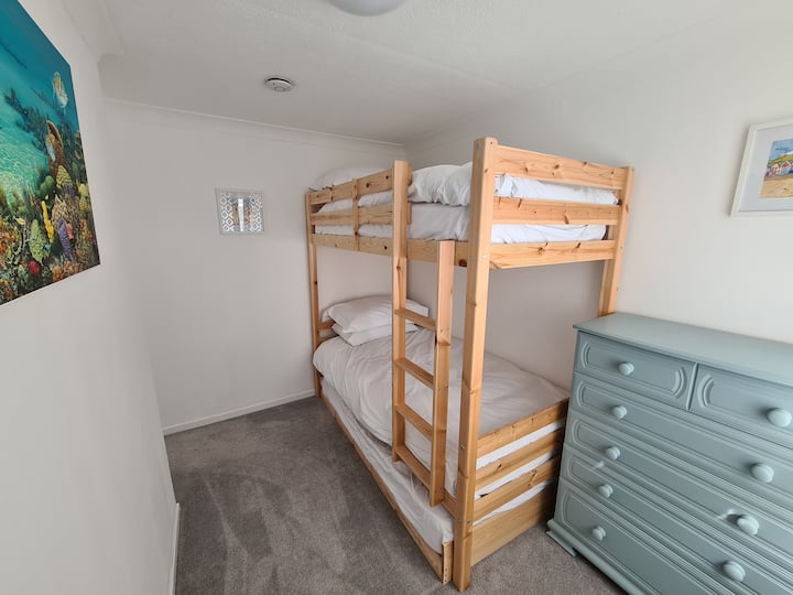Comfortable bunk bed room which sleeps 3. Bunk beds are suitable for adults. 
